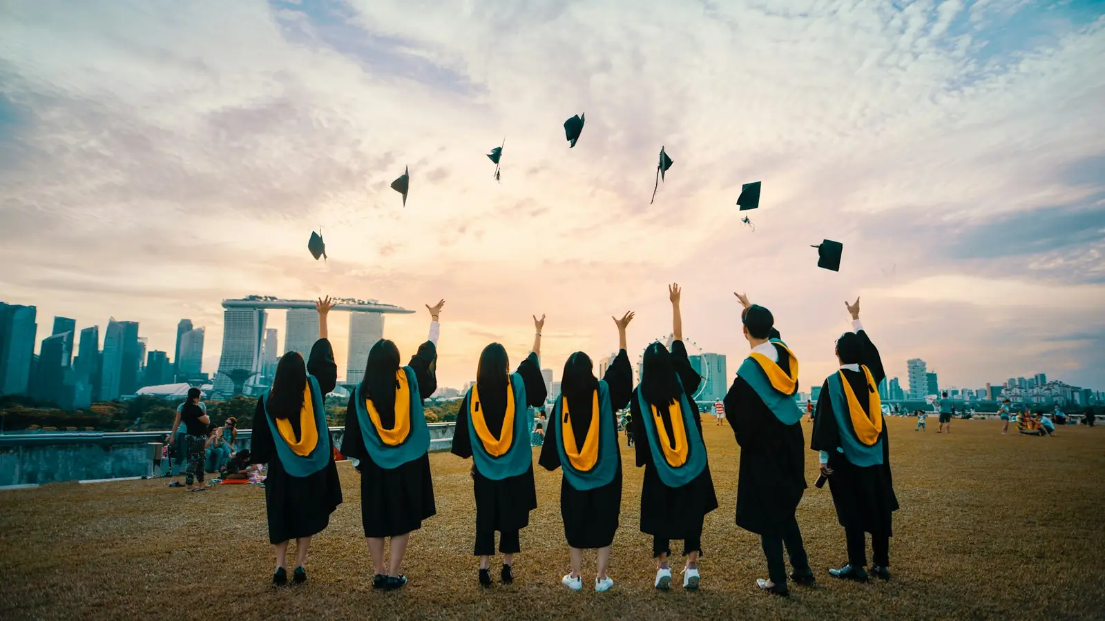 Graduates throwing their caps in the air at a commencement ceremony